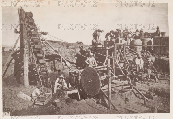 Men at work in a diamond mine in South Africa, presumably near Kimberley, page, photomechanical