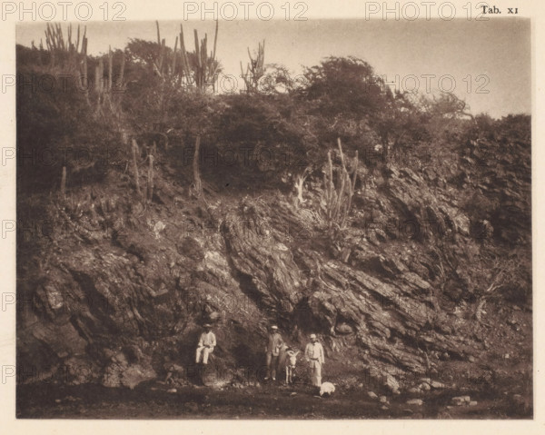 Three men with a donkey in the gorge at the foot of the Sint-Christoffelberg on Curaçao, page,