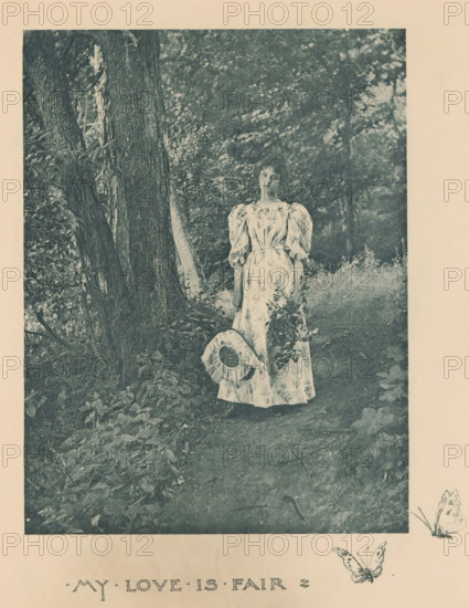 Woman in a forest with branches and a hat in her hands, page, photomechanical print, inscription: