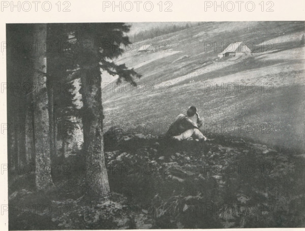 Man looking out over a landscape, with two houses in the background, page, photomechanical print,