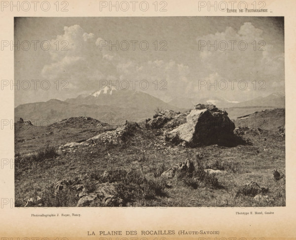 View of a landscape with a mountain range with snow-capped peaks in the background, page,