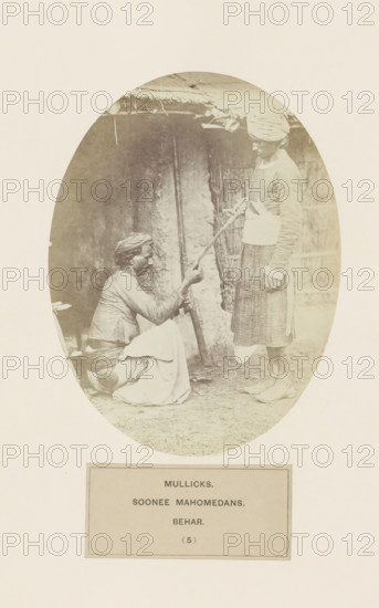 Two unknown men with a rifle from the Malik clan of Bihar in eastern India, photograph, page,