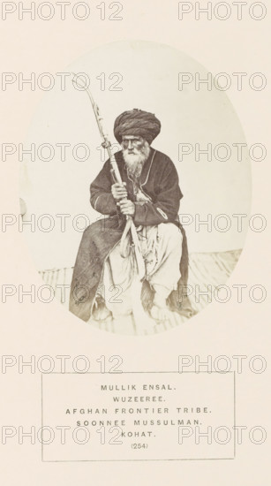 Portrait of Mullik Ensal, a man with a rifle from the Wazir tribe of Kohat, Khyber Pakhtunkhwa,