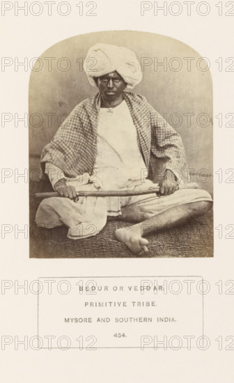 Portrait of an unknown man with a stick in his hands, Mysore, Karnataka, India, photograph, page,