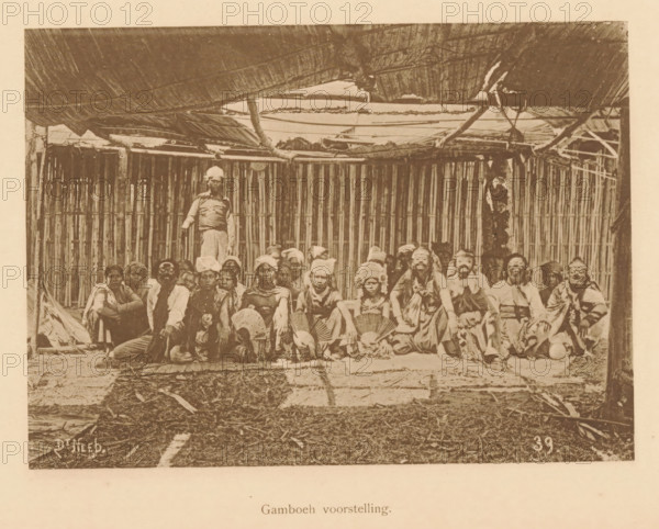 Portrait of unknown persons in costume, some with masks, Gamboeh scene, page, photomechanical