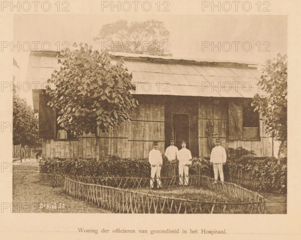 Four unknown European men in front of a house, Housing of the Medical Officers in the Hospital,
