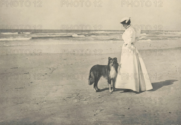 On the Beach, Woman with a dog on the beach, page, photomechanical print, photographer: William D.