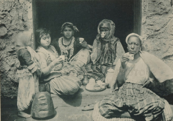 Four women drinking coffee in the Tunisian part of the Antwerp World Exhibition in 1894, Tunisia,