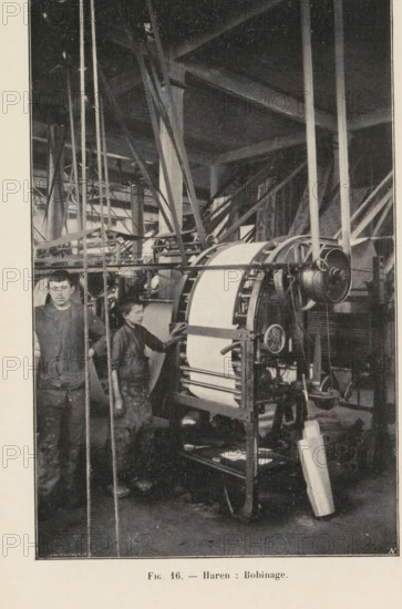 Two men and a paper bending machine in a printing shop in Haren, Belgium, page, photomechanical