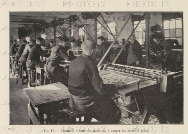 Men cut out printed playing cards in a printing house in Turnhout, page, photomechanical print,