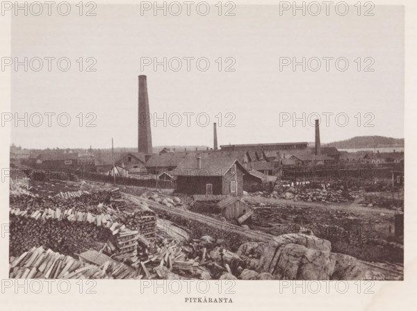 Chimneys near buildings and stacks of wood, Pitkäranta, page, photomechanical print, photographer: