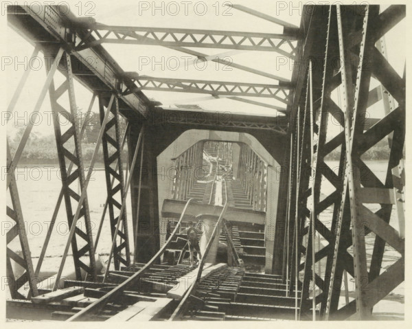 Collapsed railway bridge over the Nagara River in Japan after an earthquake, page, photomechanical