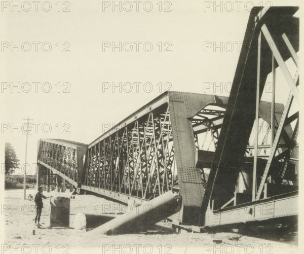 Collapsed railway bridge over the Nagara River in Japan after an earthquake, page, photomechanical