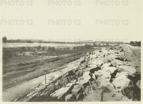View of a collapsed railway bridge over the Nagara River in Japan after an earthquake, page,