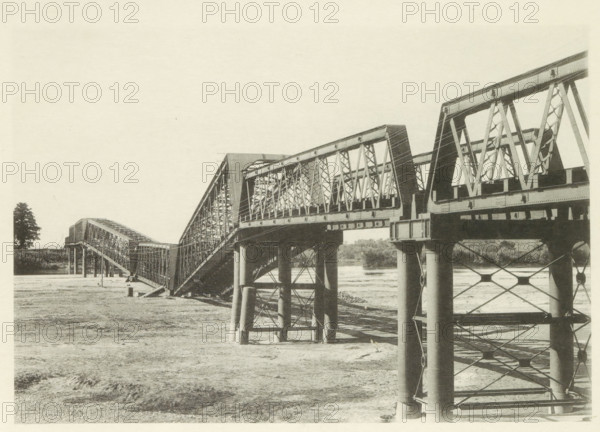 Collapsed railway bridge over the Nagara River in Japan after an earthquake, page, photomechanical