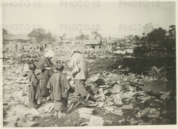 Two women with children stand among the destruction in Japan after an earthquake, page,