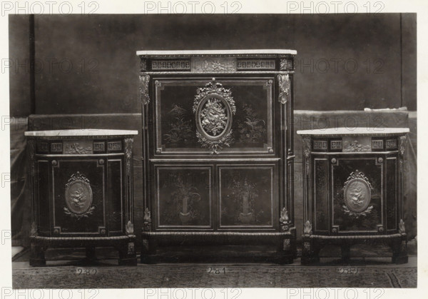 Secretary and two triangular corner pieces of furniture decorated with medallions and plant motifs,