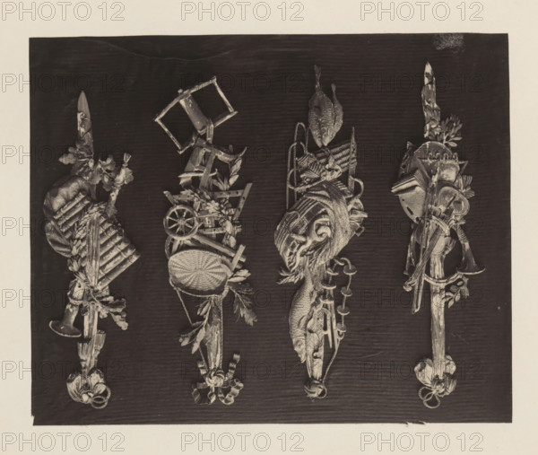 Four small trophies of music, fish and agriculture in giltwood from the collection of Antonin