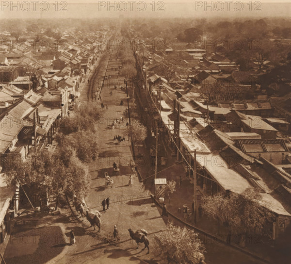 Street view in Beijing, page, photomechanical print, photographer: Donald Mennie, Beijing, cliché