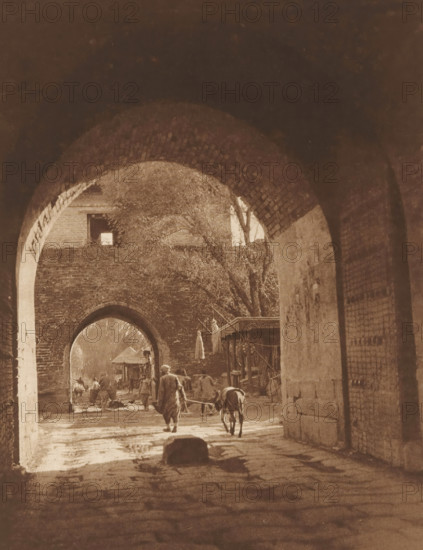 View of two gates in Beijing, page, photomechanical print, photographer: Donald Mennie, Beijing,