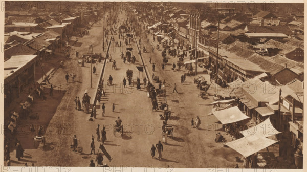 Street view in Beijing, page, photomechanical print, photographer: Donald Mennie, Beijing, cliché