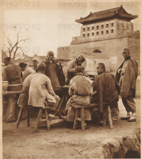 Group of unknown men, some of whom smoke pipes, page, photomechanical print, photographer: Donald