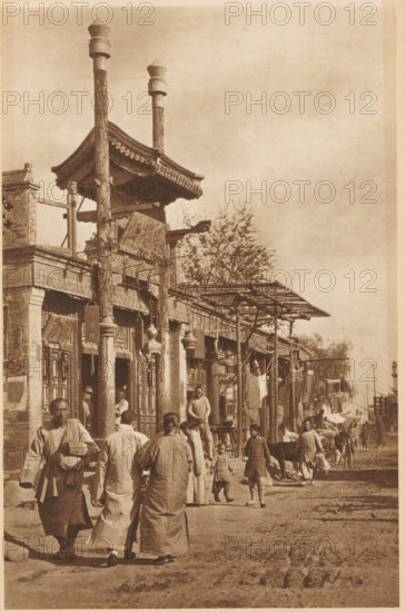 Street view in Beijing, page, photomechanical print, photographer: Donald Mennie, Beijing, cliché