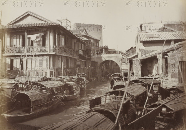 Boats and houses in Canton, album page, photograph, Part of Album with 50 photos of a trip through