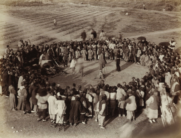 Chinese people in a circle at an outdoor board game, album page, photograph, Part of Album with 50