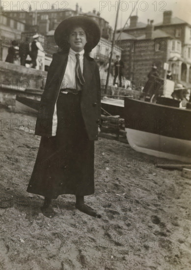 Else Wachenheimer-Moos with a hat in front of a boat on the beach, Bexhill-on-Sea, 1913,