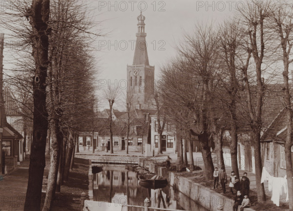 View of Medemblik with the tower of the Reformed Church, photograph, inscription: 'B. Reekers,