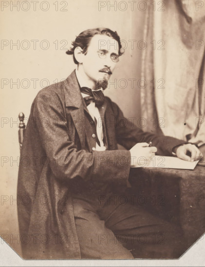 Portrait of possibly an architect, drawing with pencil in his hand, photograph, photographer: