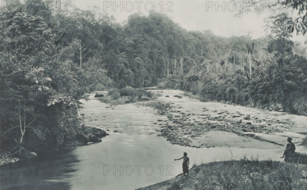 Soengei - Bowaya, Two people on the bank of the Soengei-Bowaya on Sumatra, Two Indonesian people on