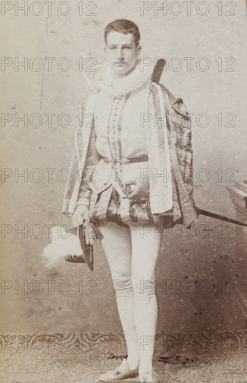Portrait of Tj.AMA Humalda van Eysinga in costume with hat in hand, album page, photograph,