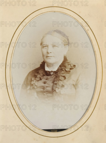 Portrait of a woman, album page, photograph, cabinet photograph, This photo is part of an album.,