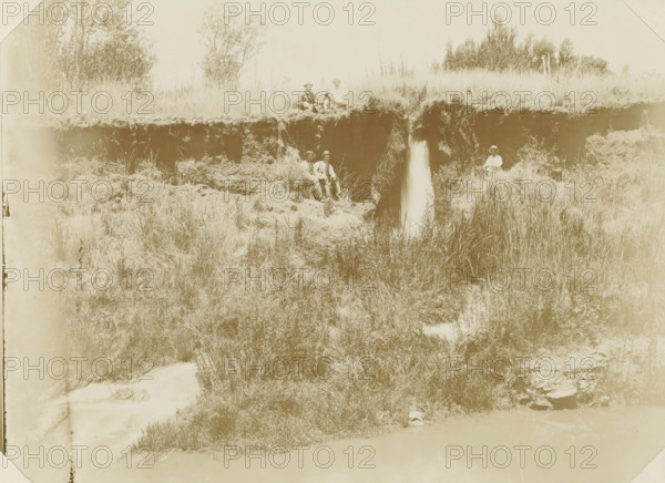 Near Pretoria, Europeans with a dog next to a waterfall near Pretoria, photograph, Part of Album