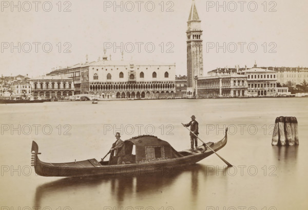 View of the Doge's Palace, the Campanile and surrounding buildings in Venice with a gondola in the