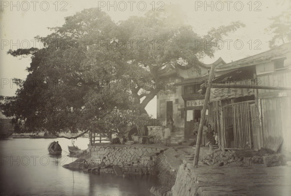 View of a house with a yard along the water, presumably in Fuzhou, photograph, Part of travel album