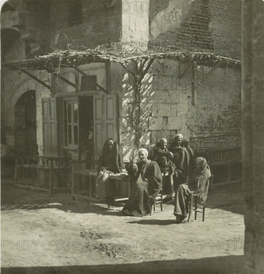 Luksor. Arabs Cafe, Guests in front of a café in Luxor, stereograph, number: '148', Luxor,