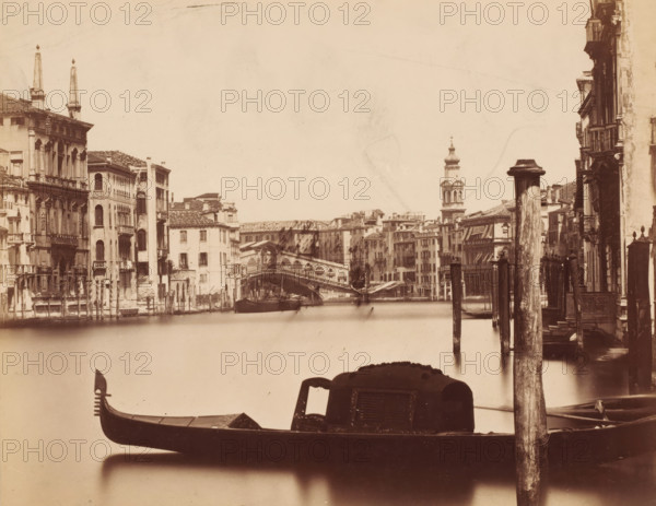 View of the Grand Canal with the Rialto Bridge in the background in Venice, Italy, photograph,