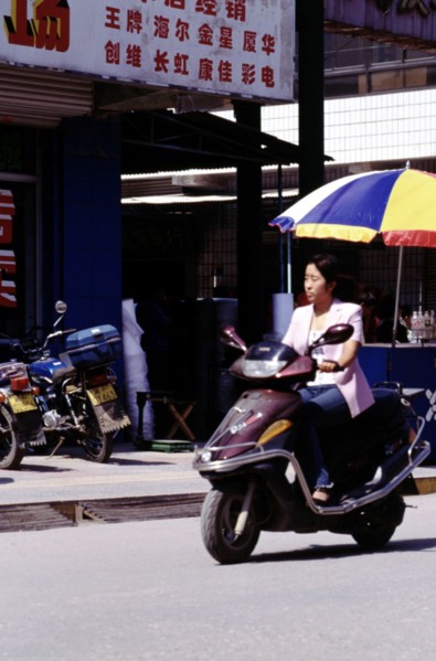 A woman riding motor