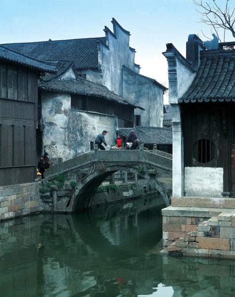 Houses on a river bank, China