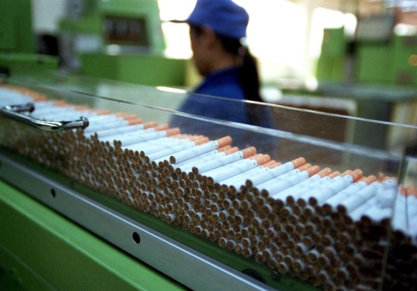 A female worker works on the cigarette assembling line of a tobacco factory of Wuhan, China