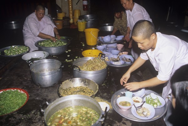 Buddhist nuns prepare lunch in a monastery in Thailand