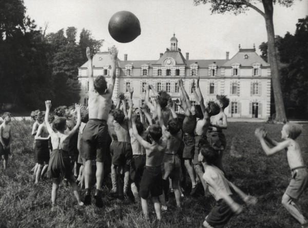 Children in a summer camp playing with a ball