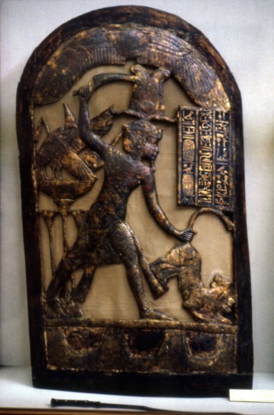 Stele representing the king guided by the falcon in the position of killing a wild animal held by the tail