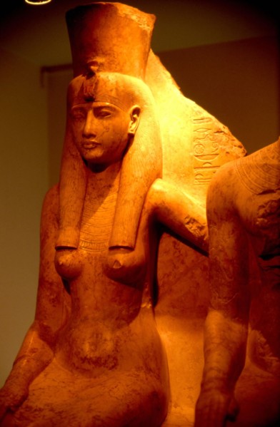 Seated goddess Mut, "mistress of AIcheru", protecting the king with her arm