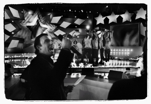 12/00/2003. Nikos Aliagas, host of the Star Academy shows backstage and on stage.
