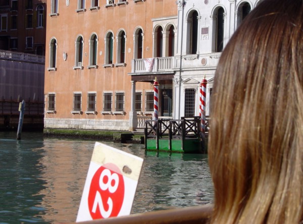 A strawberry blonde before Palazzi Cappello Layard and Grimani Marcello in Venice