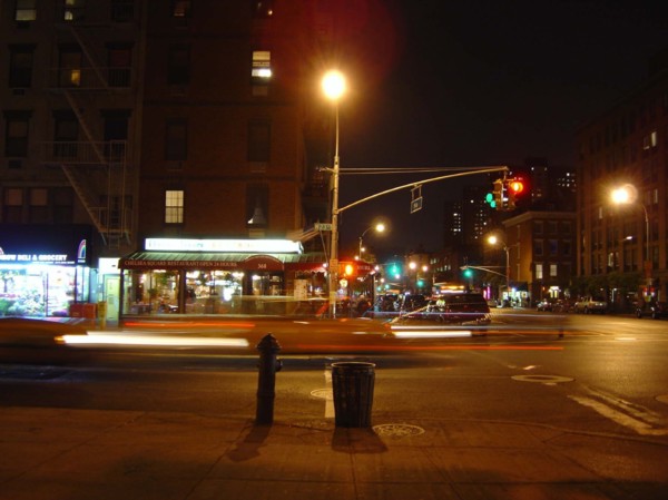 Intersection of a street and an avenue at night in Chelsea, New York
